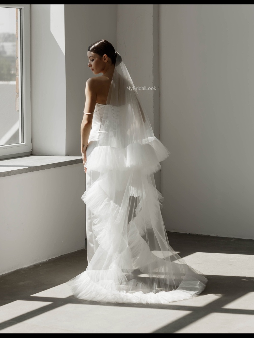 Church length white ruffle veil
